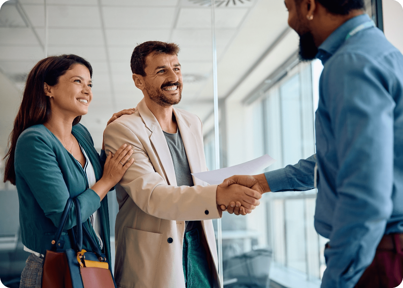 happy-couple-handshaking-with-their-financial-advi-2024-01-12-16-47-59-utc@2x-min happy-couple-handshaking-with-their-financial-advi-2024-01-12-16-47-59-utc@2x-min